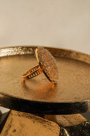 Yasna gold plated AD statement dome ring side profile on gold tray showing lattice design South Asian jewelry