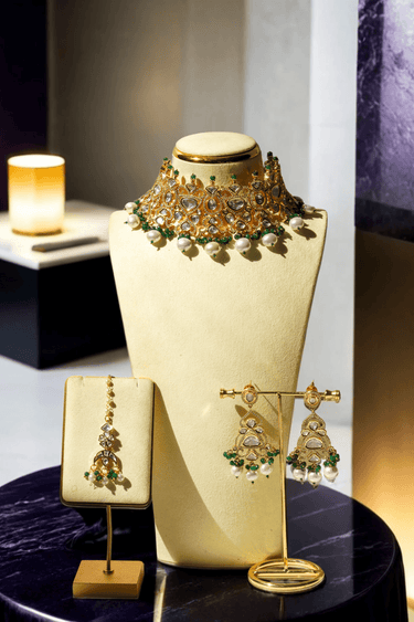 Kainat bridal choker necklace set with moissanite polki stones, green and pearl accents, and matching earrings