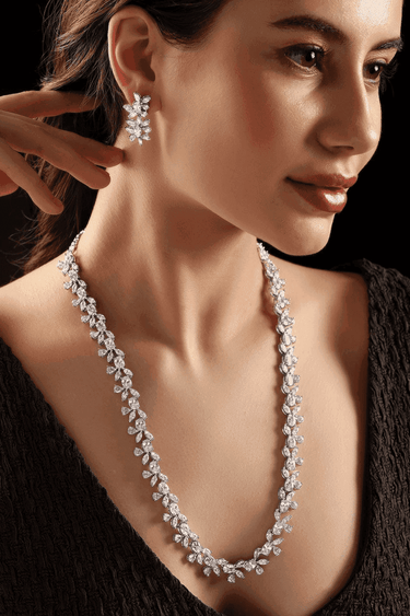 Lama Single Layer Long Diamante Accent AD Necklace Set in rhodium-plated silver or gold finish with intricate floral pattern and matching dangling earrings.
