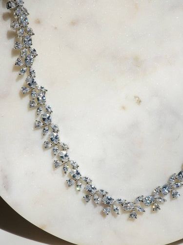 Lama Single Layer Long Diamante Accent AD Necklace Set in rhodium-plated silver or gold finish with intricate floral pattern and matching dangling earrings.