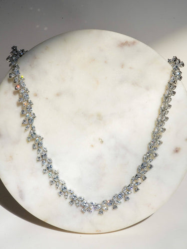 Lama Single Layer Long Diamante Accent AD Necklace Set in rhodium-plated silver or gold finish with intricate floral pattern and matching dangling earrings.