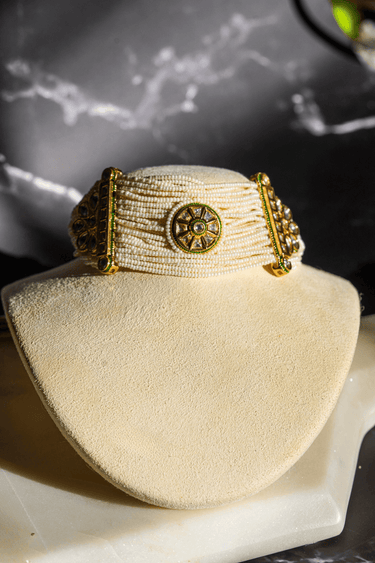 Mona Pearl Moissanite Polki Choker Set – Indian Jewelry featuring layered pearl strands, central floral moissanite polki motif, and gold accents.