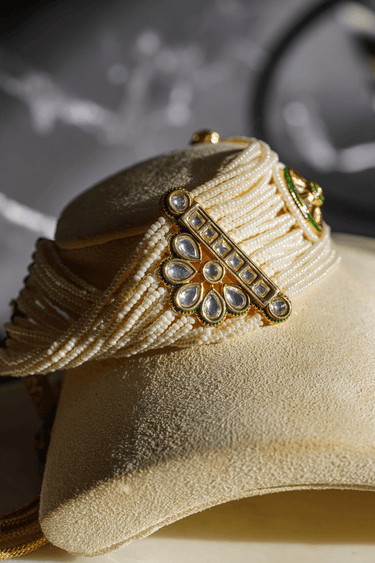 Mona Pearl Moissanite Polki Choker Set – Indian Jewelry featuring layered pearl strands, central floral moissanite polki motif, and gold accents.