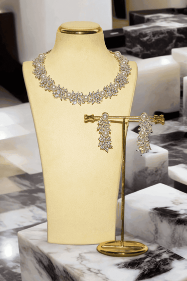 Mukta Diamante Accent AD Necklace Set - Rhodium or rose gold-plated finish, adorned with AD stones and faux pearls, featuring intricate floral patterns and matching minimal earrings.