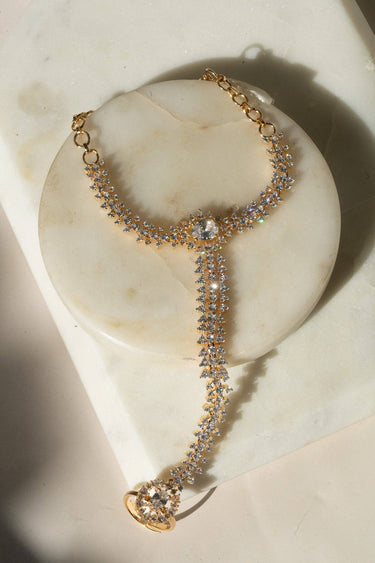 Nayla statement haathphool - hand chain bracelet in gold with ring