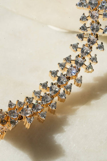 Nayla statement haathphool - hand chain bracelet in gold with ring