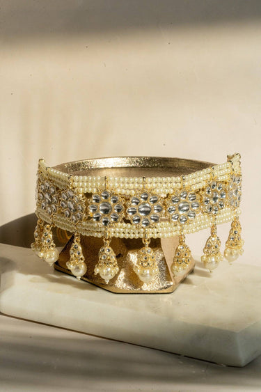 Neeshy champagne gold plated choker necklace set with resin bead detailing , paired with jhumka earrings and maang tikka from Inaury