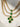 Niara Triple Layer Diamante Accent AD Necklace Set in gold or rhodium-plated silver finish with color options of silver & sapphire blue, silver & green, gold & green, and silver & ruby, featuring triple-layered chain links and matching statement earrings.