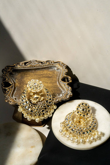 Nura Kundan Chandbali and Maang Tikka set on marble