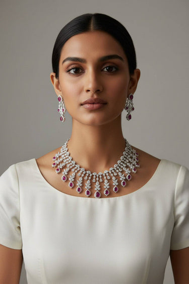 Raha Diamante Accent Classic Necklace Set with ruby pink stones on model wearing ivory crew neck top