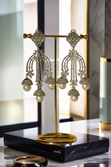 Raina - Pearl Jhumka Earrings with pavé-set white stones and faux pearls – Indian jewelry for bridal and festive wear.