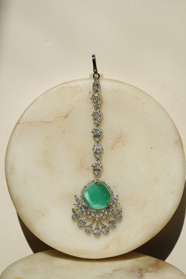 Rina Silver Maang Tikka with green stone and sparkling accents