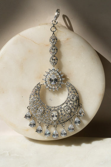 Rhodium-plated silver and white maang tikka with American Diamond stones in pink, ruby, mint green, and white from Inaury
