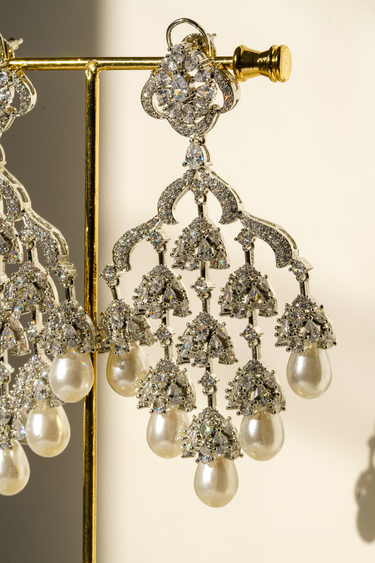 Detailed view of Sahara Earrings - Pearl and Rhodium Design with layered AD stones and elegant pearl drops, perfect for timeless elegance.