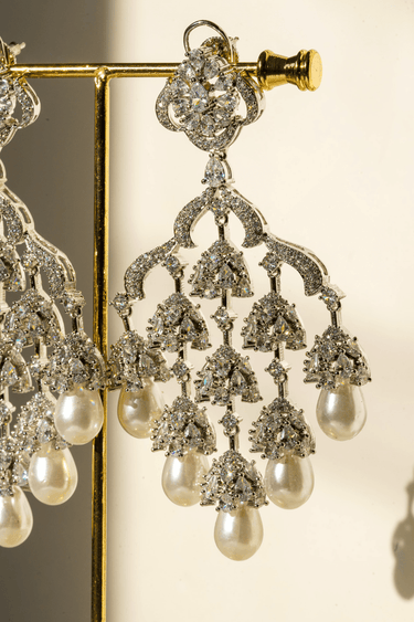 Detailed view of Sahara Earrings - Pearl and Rhodium Design with layered AD stones and elegant pearl drops, perfect for timeless elegance.