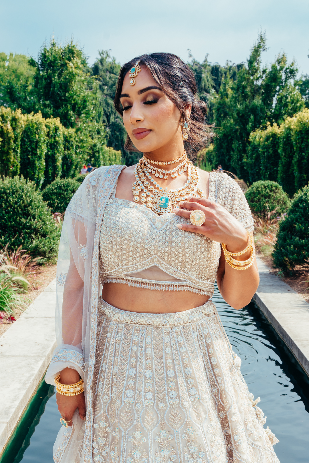 Siham Indian bridal jewelry set with moissanite polki stones, gold plating, turquoise centerpiece, and green accents