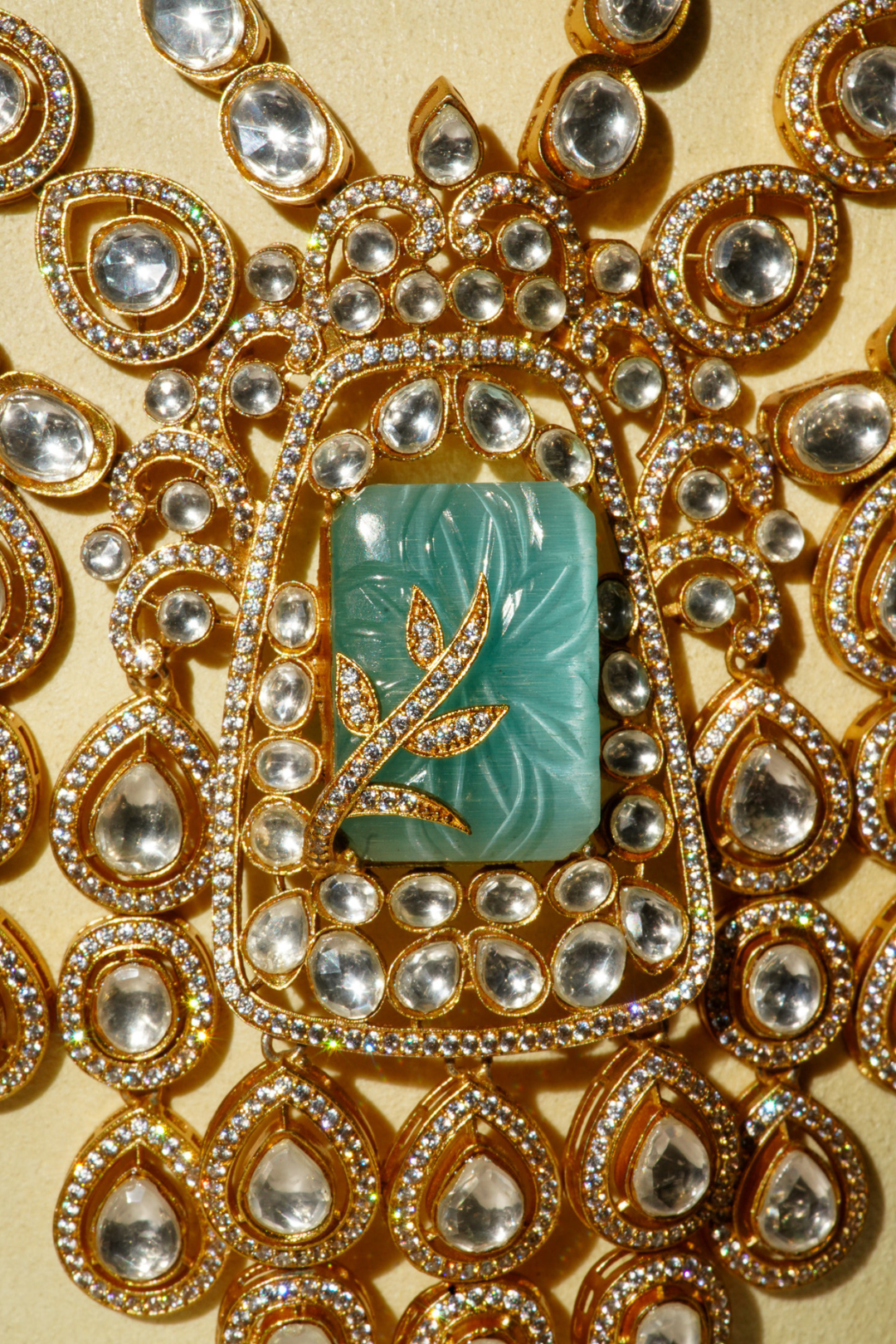 Siham Indian bridal jewelry set with moissanite polki stones, gold plating, turquoise centerpiece, and green accents