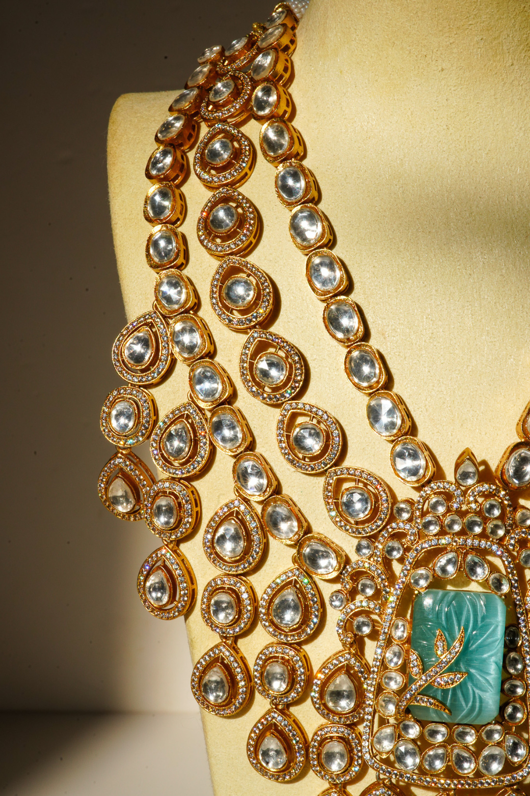 Siham Indian bridal jewelry set with moissanite polki stones, gold plating, turquoise centerpiece, and green accents
