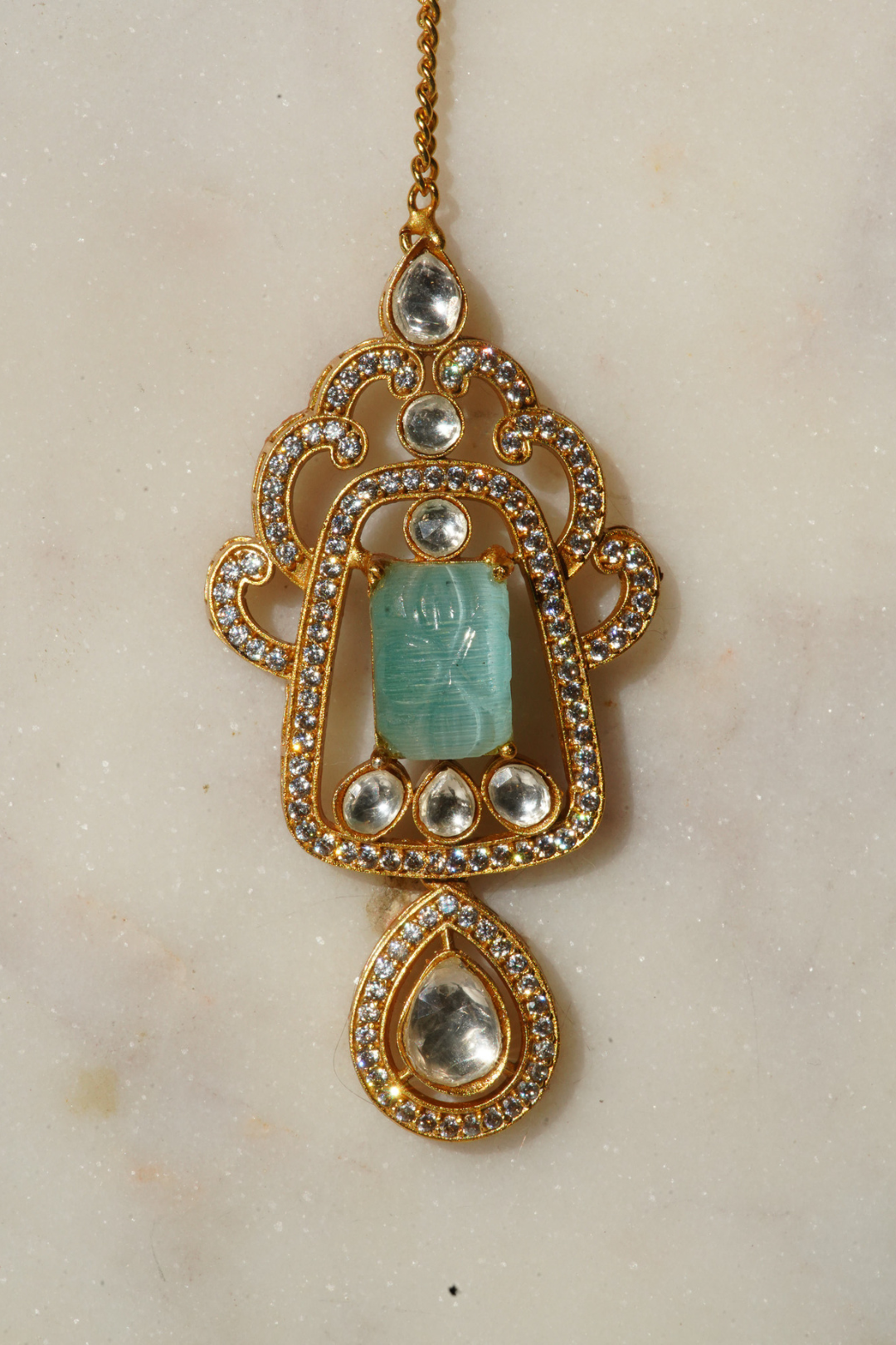 Siham Indian bridal jewelry set with moissanite polki stones, gold plating, turquoise centerpiece, and green accents