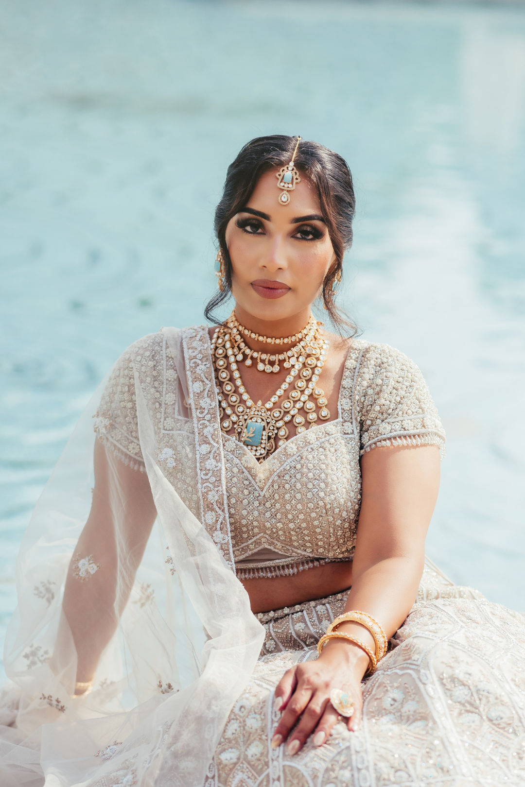 Siham Indian bridal jewelry set with moissanite polki stones, gold plating, turquoise centerpiece, and green accents