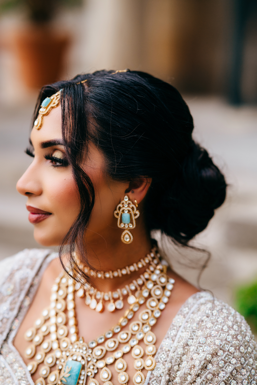 Siham Indian bridal jewelry set with moissanite polki stones, gold plating, turquoise centerpiece, and green accents