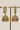 AD diamante jhumka earrings in gold, rhodium, and antique gold plating from Inaury