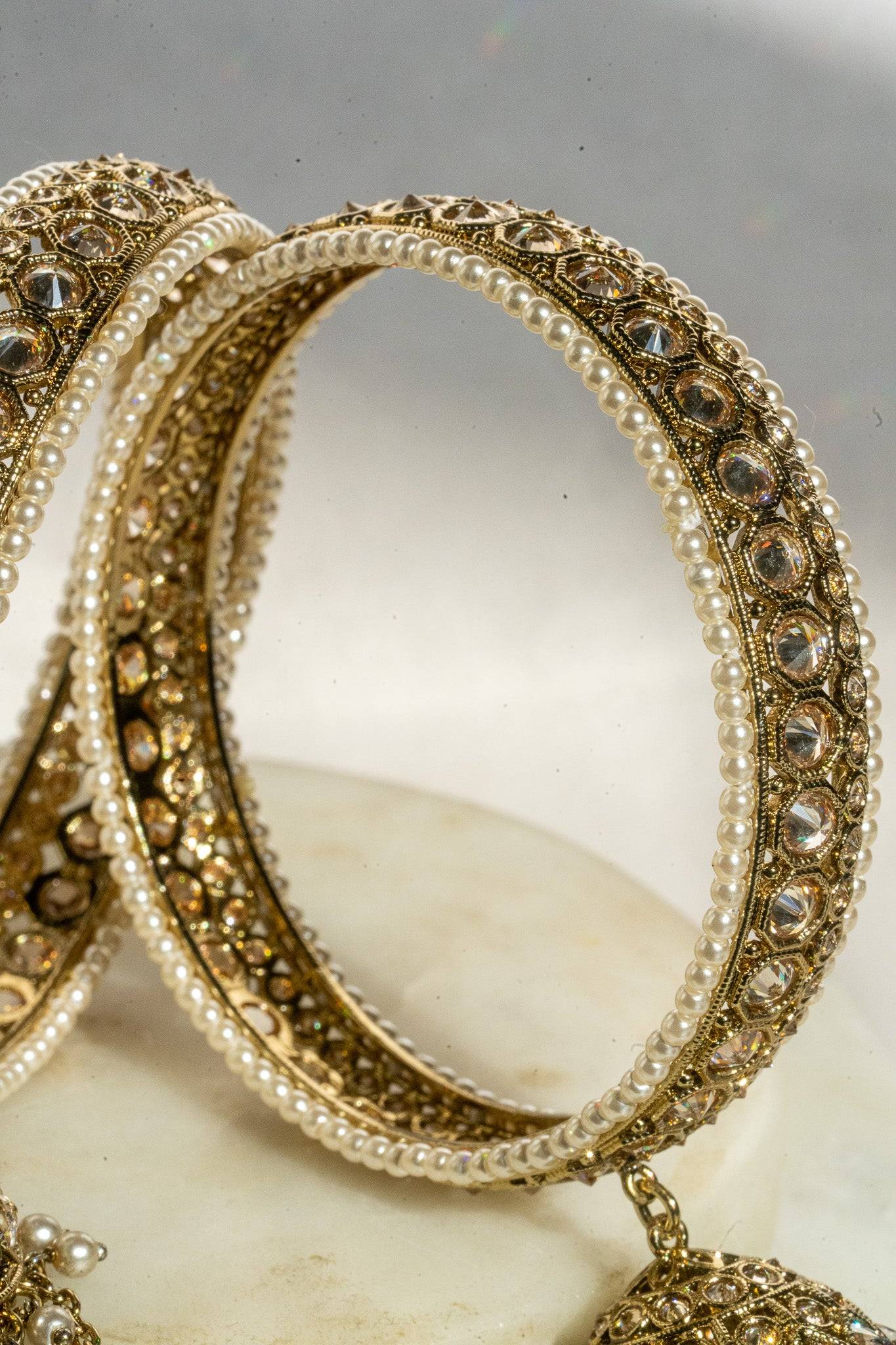 Antique mehendi gold bangle set with reverse AD stones and jhumka tassels from Inaury