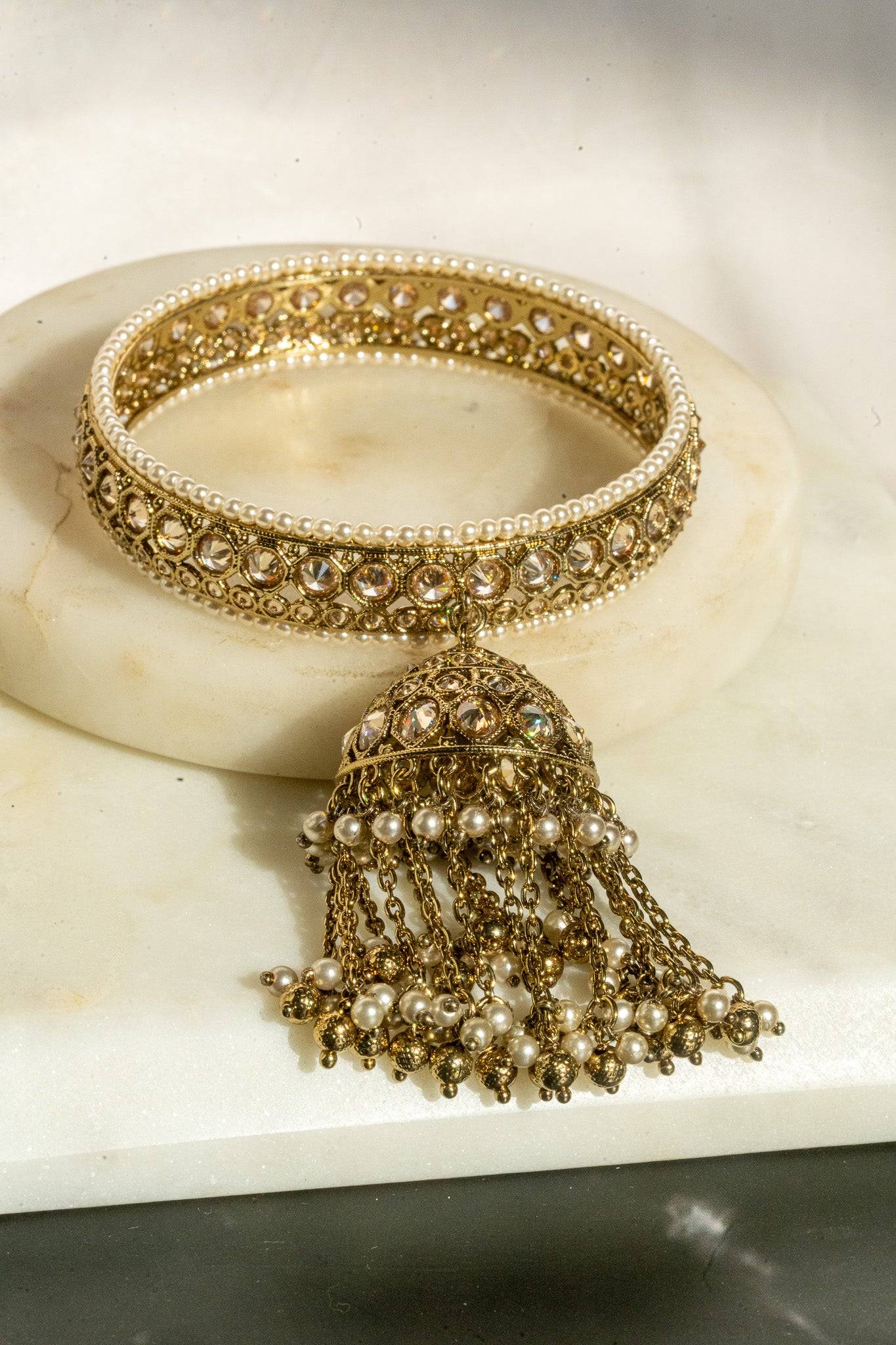Antique mehendi gold bangle set with reverse AD stones and jhumka tassels from Inaury
