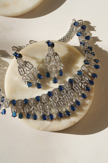 Detailed view of Aagya AD Necklace Set – Rhodium Plated in blue, featuring symmetrical stone arrangement and fine craftsmanship.