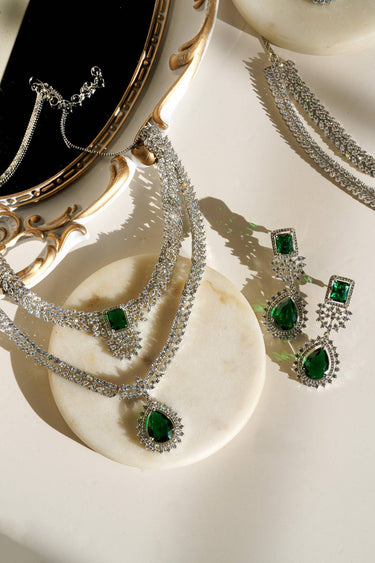 Amore Double Layer AD Necklace Set - Rhodium-plated with sparkling AD stones, available in sapphire blue or pink, featuring matching earrings and a double-layered design.