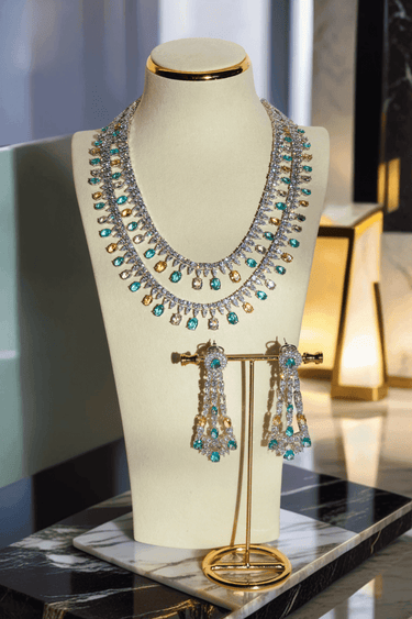 Arni Long Double Layer Diamanté AD Necklace Set - Rhodium-plated silver finish with intricate detailing, available in five colors, includes matching statement earrings.