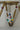 Close-up of Chahat Necklace pendant in multicolor. Floral design with vibrant AD stones and rhodium plating.