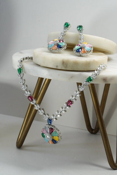 Chahat Necklace Set - Rhodium Floral AD in multicolor. Features vibrant floral pendant and matching earrings.