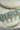 Jhanvi Choker Necklace Set - Silver & Gem Variations featuring cushion-cut AD stones with mint green teardrop accents, includes matching earrings.