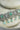 Jhanvi Choker Necklace Set - Silver & Gem Variations featuring cushion-cut AD stones with mint green teardrop accents, includes matching earrings.