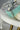 Jhanvi Choker Necklace Set - Silver & Gem Variations featuring cushion-cut AD stones with mint green teardrop accents, includes matching earrings.