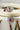 Jhanvi Choker Necklace Set - Silver & Gem Variations featuring cushion-cut AD stones with ruby teardrop accents, includes matching earrings.
