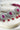 Jhanvi Choker Necklace Set - Silver & Gem Variations featuring cushion-cut AD stones with ruby teardrop accents, includes matching earrings.