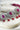 Jhanvi Choker Necklace Set - Silver & Gem Variations featuring cushion-cut AD stones with ruby teardrop accents, includes matching earrings.