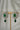 Jhanvi Choker Necklace Set - Silver & Gem Variations featuring cushion-cut AD stones with green teardrop accents, includes matching earrings.
