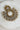 Laila Chandbali Earring in antique gold with dual-circle design, white stones, and pearl border, laid on a marble surface.