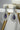 Mirah AD Earrings - Elegant Jewelry featuring purple teardrop center and CZ halo, part of the teardrop necklace set.