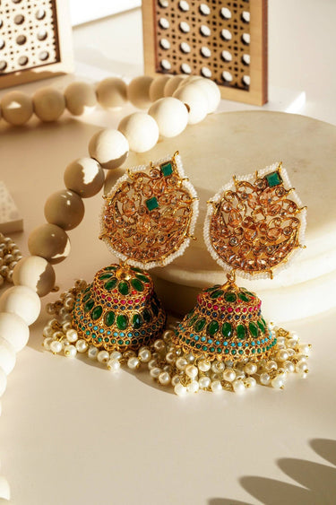 Elegant Mishti Jhumkas with green stones and gold filigree, perfect for weddings and festive Indian jewelry collections.
