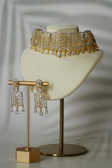 Gold-tone version of Nafisha AD Choker Set with earrings, displayed on a bust to showcase dual-tone elegance and sparkle.