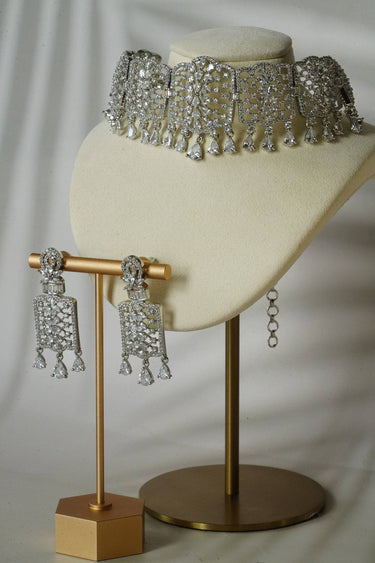 Nafisha Silver & AD Stone Choker Set displayed on a bust with matching CZ earrings, showcasing intricate detailing and teardrop accents.