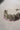 Side view of lavender beaded choker from Namar Silver Plated AD Indian Choker Necklace Set on marble base.