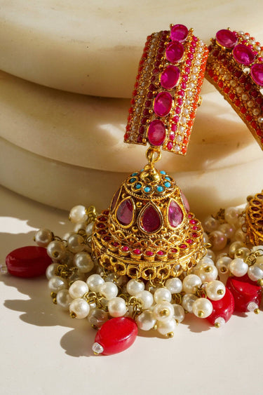 Navdeep Jhumka Earrings - Handcrafted with antique gold plating, available in ruby, blue, or gold, featuring multi-color stones and embellishments.
