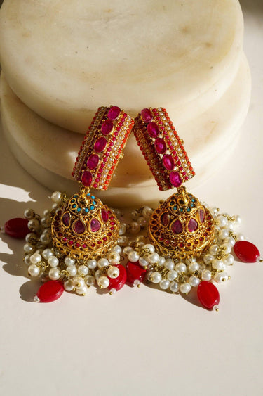 Navdeep Jhumka Earrings - Handcrafted with antique gold plating, available in ruby, blue, or gold, featuring multi-color stones and embellishments.