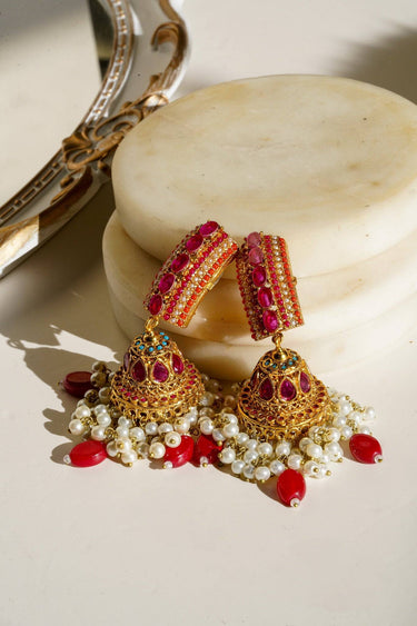 Navdeep Jhumka Earrings - Handcrafted with antique gold plating, available in ruby, blue, or gold, featuring multi-color stones and embellishments.