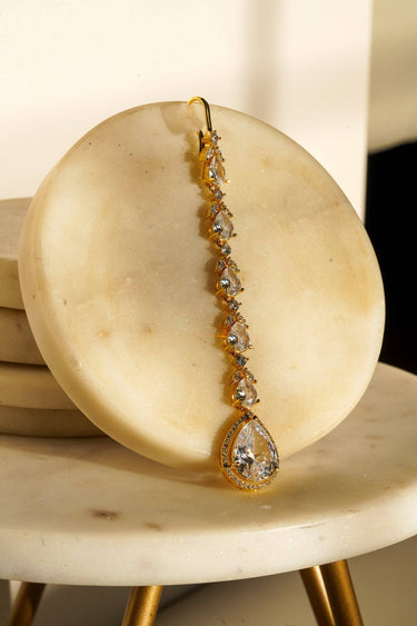 Nila Diamanté Accent Golden AD Maang Tikka - Gold-plated with teardrop stones and diamante accents, available in gold & multicolor or gold & white.